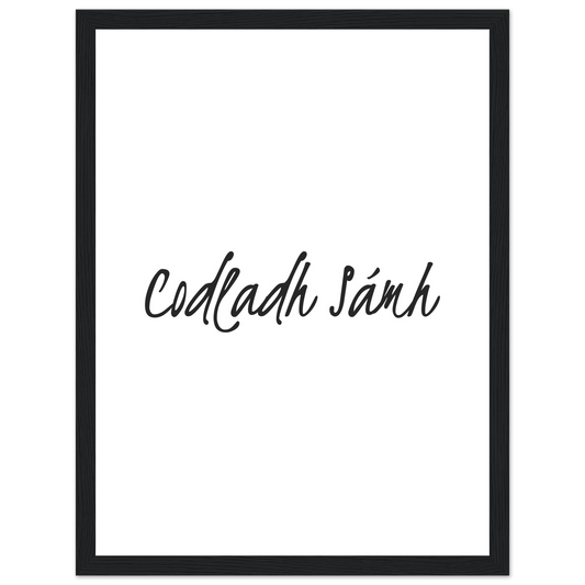 Codladh Sámh handwritten Irish phrase print in a black frame, black script on white