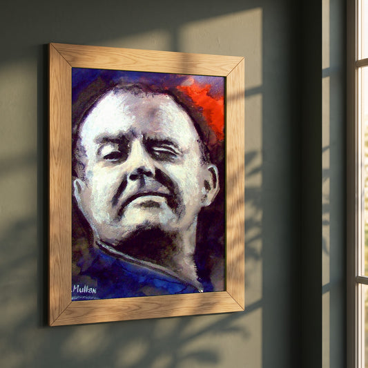 Christy Moore framed print in a natural oak frame on a dark green wall beside a window, dappled plant shadow