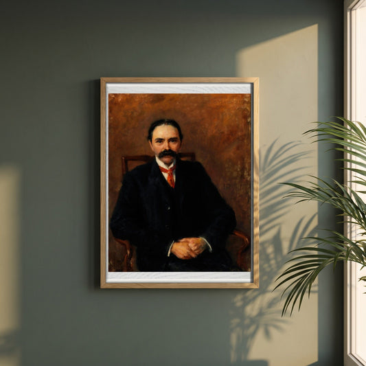 Douglas Hyde framed print in a natural oak frame on a dark green wall beside a window, dappled plant shadow