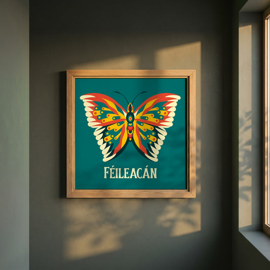 Féileacán framed print in a natural oak frame on a dark green wall beside a window, dappled plant shadow