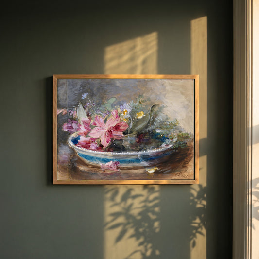 Flowers in a Bowl framed print in a natural oak frame on a dark green wall beside a window, dappled plant shadow