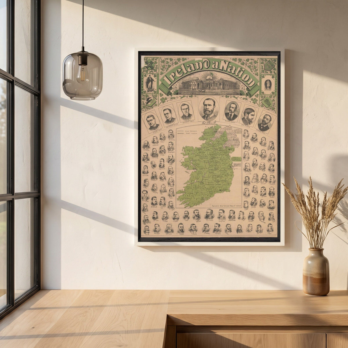 Ireland a Nation, Parnell's National Map of Ireland framed print in a white frame on a plaster wall above an oak worktop in a bright Scandinavian kitchen