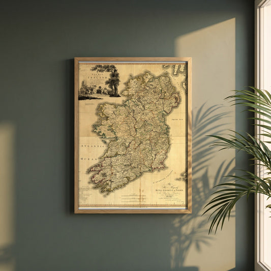 Memoir of a Map of Ireland by Daniel Augustus Beaufort framed print in a natural oak frame on a dark green wall beside a window, dappled plant shadow