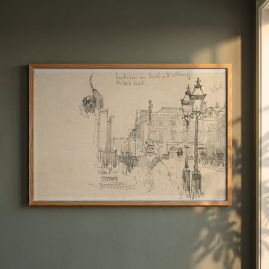Merrion Row, Dublin, and Tracton House framed print in a natural oak frame on a dark green wall beside a window, dappled plant shadow
