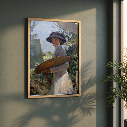 Mrs Lavery Sketching framed print in a natural oak frame on a dark green wall beside a window, dappled plant shadow