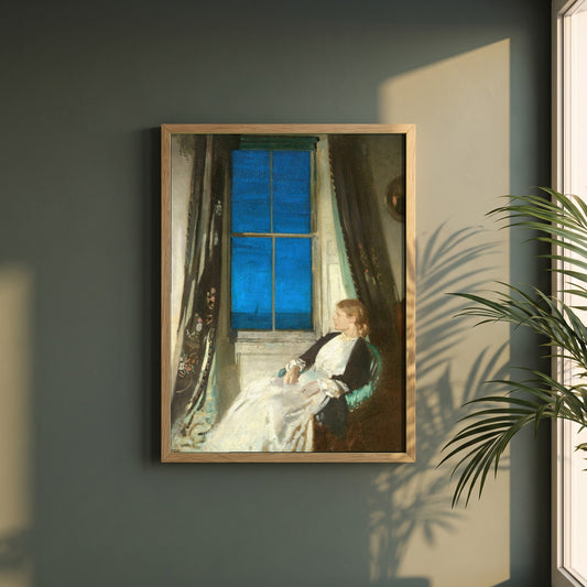 Night framed print in a natural oak frame on a dark green wall beside a window, dappled plant shadow