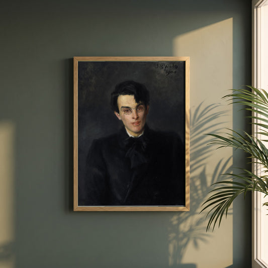 Portrait of W.B. Yeats framed print in a natural oak frame on a dark green wall beside a window, dappled plant shadow
