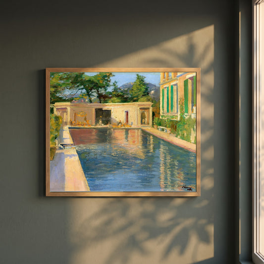 Swimming Pool, Southern France framed print in a natural oak frame on a dark green wall beside a window, dappled plant shadow