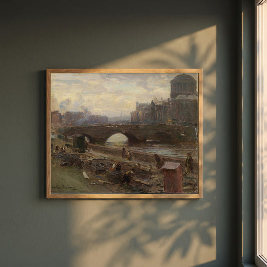 The Four Courts, Dublin framed print in a natural oak frame on a dark green wall beside a window, dappled plant shadow