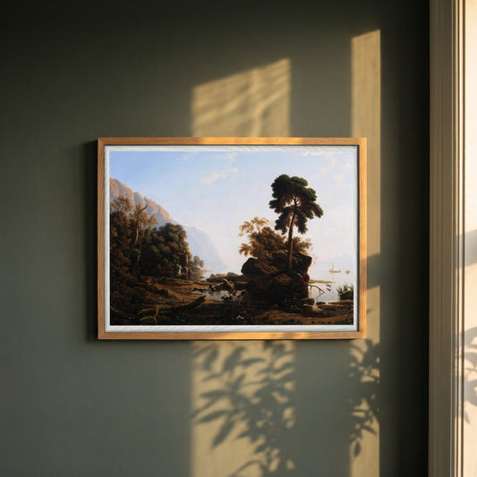 The Stag Hunt by Francis Danby framed print in a natural oak frame on a dark green wall beside a window, dappled plant shadow