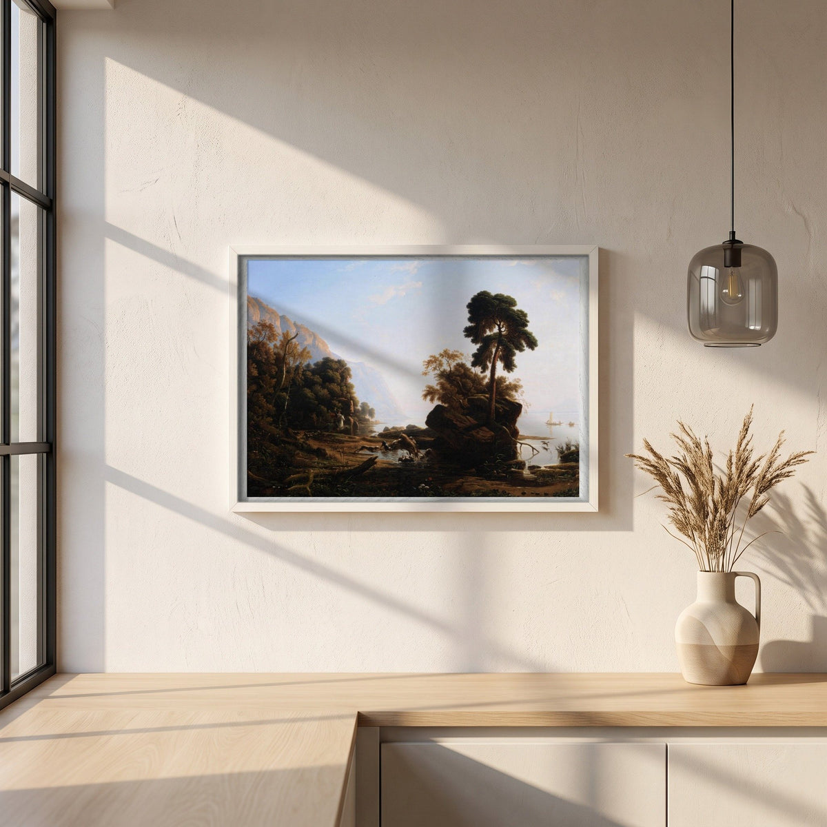 The Stag Hunt by Francis Danby framed print in a white frame on a plaster wall above an oak worktop in a bright Scandinavian kitchen