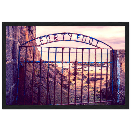 Forty Foot gate at Sandycove, a framed Irish sea swimming print with a wrought-iron gate at sunset