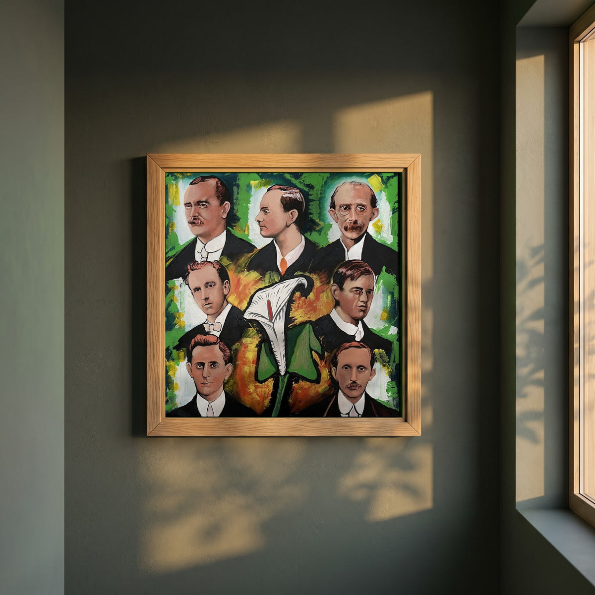 1916 Proclamation framed print in a natural oak frame on a dark green wall beside a window, dappled plant shadow