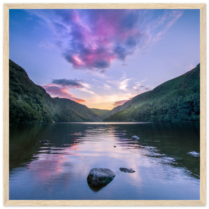 Framed wall art print of Glendalough Valley, featuring the Upper Lake at dusk with serene sky reflections,
 in a wooden frame.