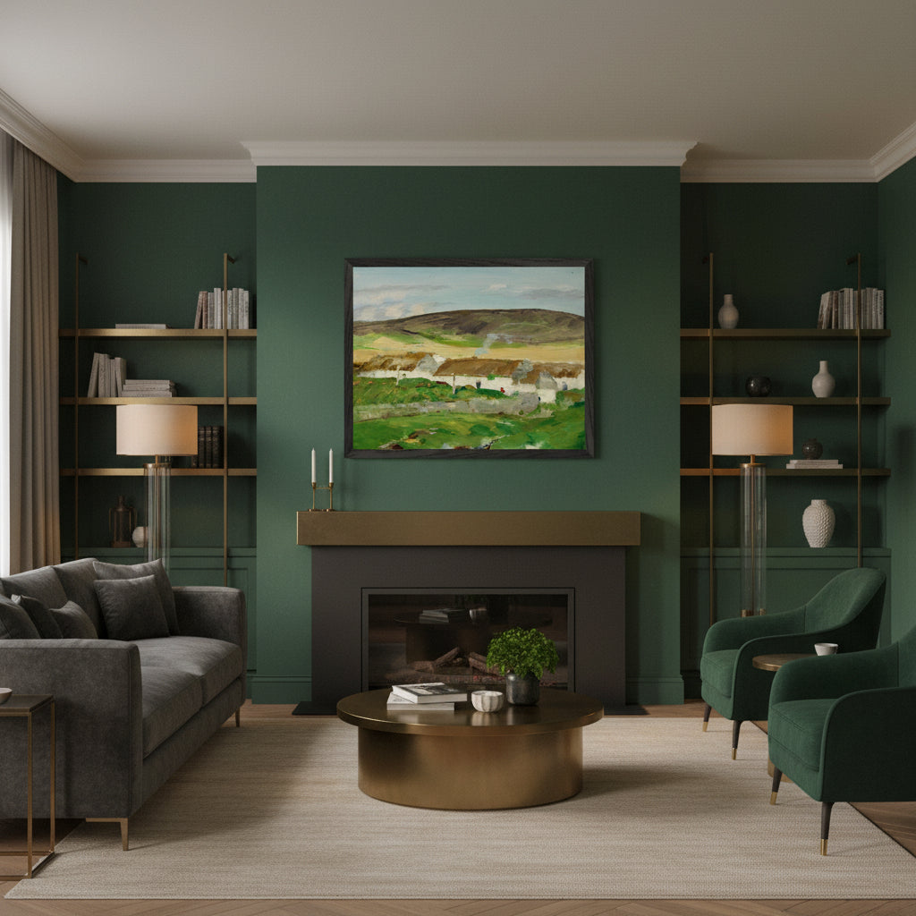 Irish landscape print of white thatched cottages and green hills, unframed 40×50 cm museum-quality matte paper. Black framed Irish landscape art print above a modern fireplace, deep green walls, brass accents, warm evening light, upscale contemporary Irish home.