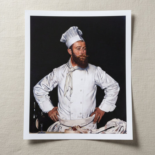 Le Chef de l’Hôtel Chatham (1921) by William Orpen Collector’s Edition art print 40 × 50 cm / 16 × 20 in 40×50 cm unframed archival print resting on light linen fabric. Soft natural daylight, gentle shadows, artisanal fine-art photography style.
