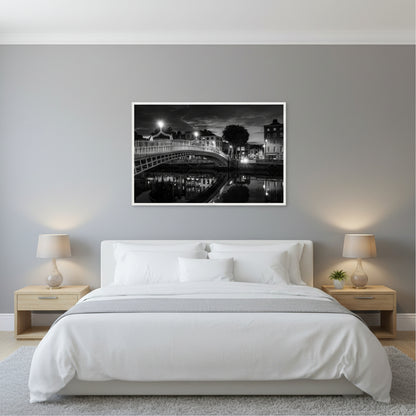 Contemporary bedroom, soft grey walls, king bed with white linens, large 60x90 cm Ha’penny Bridge black and white print in white frame above the headboard, warm bedside lamps, calm and elegant atmosphere, realistic interior wall art