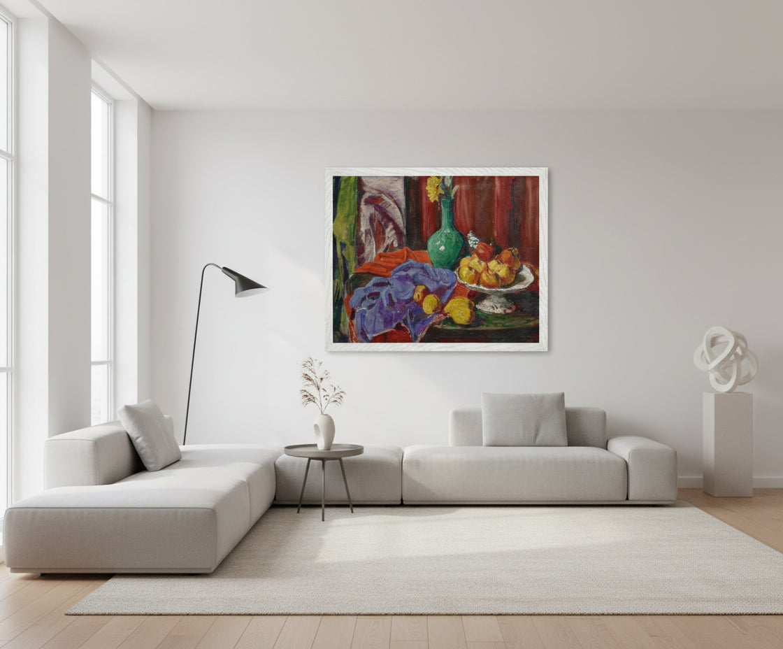 Roderic O’Conor Still Life of Fruit and Green Vase (1919) in a white gallery frame, hung in a bright contemporary living room with white walls, clean architectural lines, soft window light, premium design aesthetic.