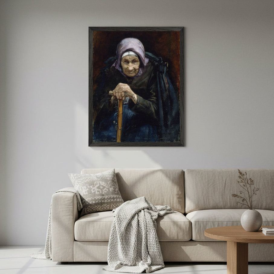 Fisherman's Mother print in a black frame above a cream sofa in a light living room
