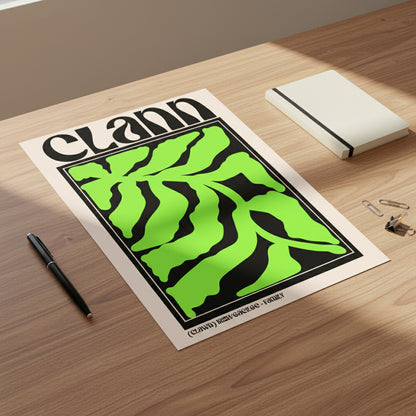 Unframed Clann Irish language family print on archival matte art paper. Unframed print placed on a wooden desk with soft natural shadows and minimalist stationery around it.