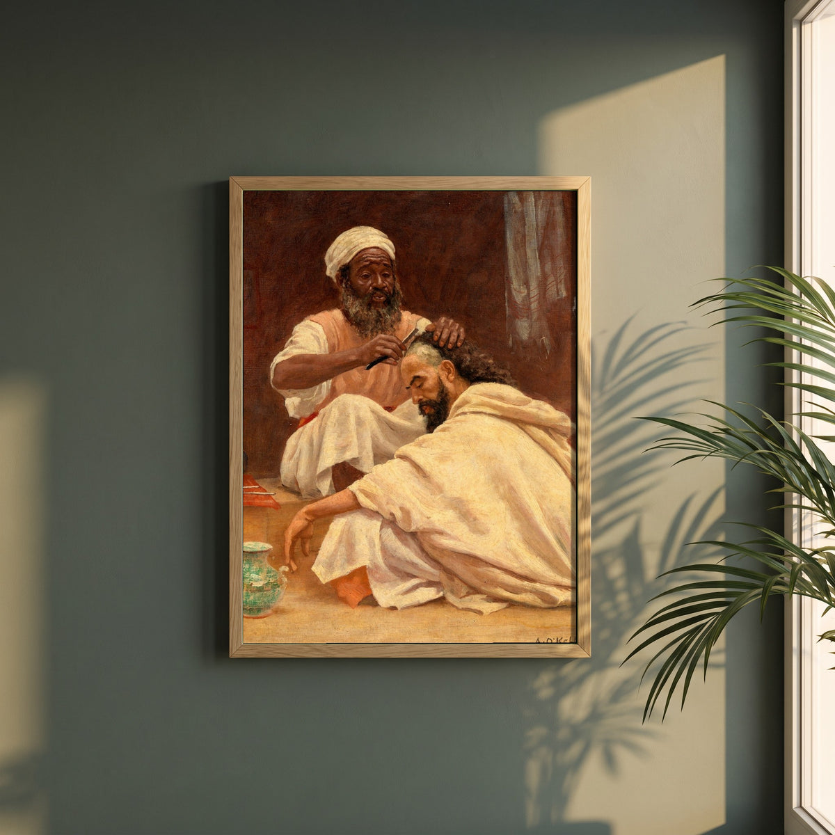 A Barber, Morocco framed print in a natural oak frame on a dark green wall beside a window, dappled plant shadow