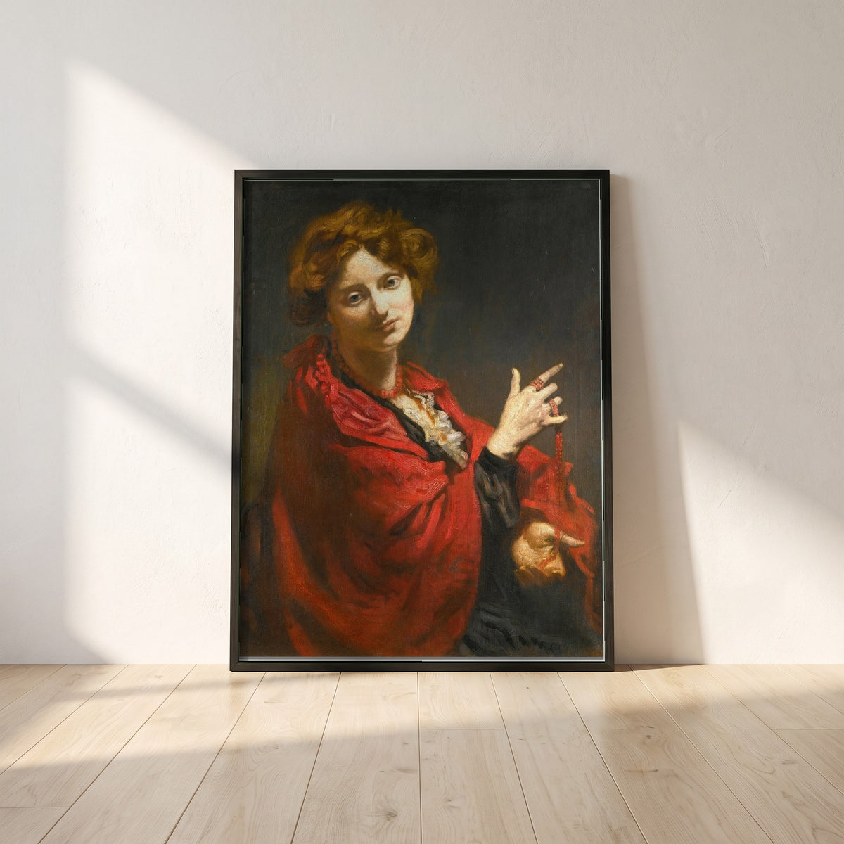Anita Bartle, The Red Shawl framed print in a black frame leaning against a white plaster wall on oak floorboards in morning light