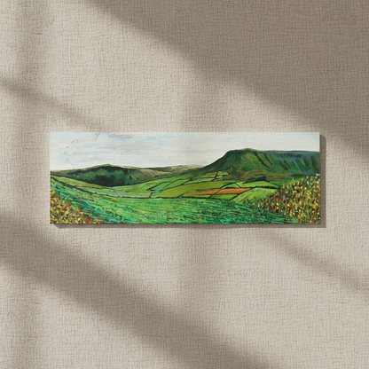 Green Glens of Antrim panoramic canvas on a textured linen-effect wall in soft window light