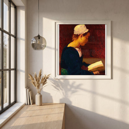 Breton Girl Reading (Bretonne Lisant) framed print in a white frame on a plaster wall above an oak worktop in a bright Scandinavian kitchen