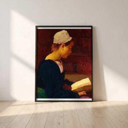 Breton Girl Reading (Bretonne Lisant) framed print in a black frame leaning against a white plaster wall on oak floorboards in morning light