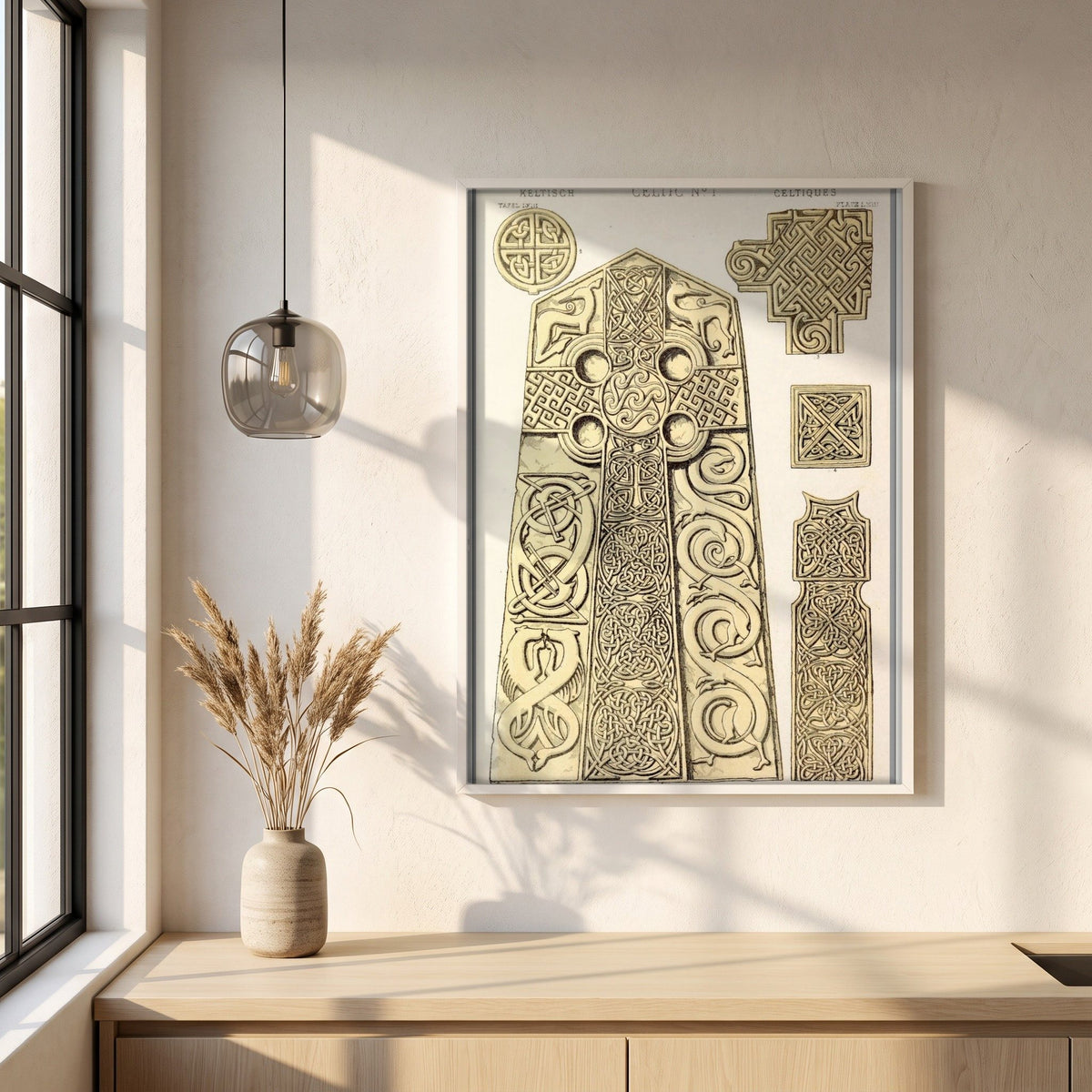 Celtic No.1 by Owen Jones framed print in a white frame on a plaster wall above an oak worktop in a bright Scandinavian kitchen