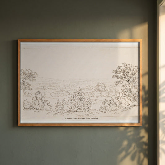 Chertsey, Surrey, from Botleys House framed print in a natural oak frame on a dark green wall beside a window, dappled plant shadow