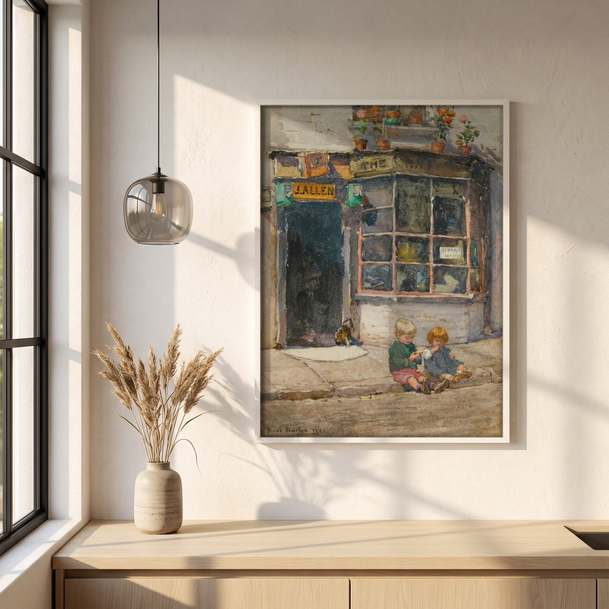Cobbler's Shop, Knightsbridge framed print in a white frame on a plaster wall above an oak worktop in a bright Scandinavian kitchen
