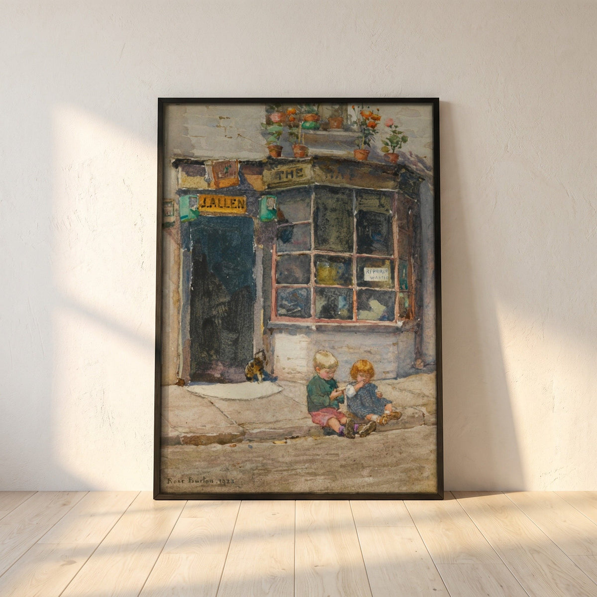 Cobbler's Shop, Knightsbridge framed print in a black frame leaning against a white plaster wall on oak floorboards in morning light