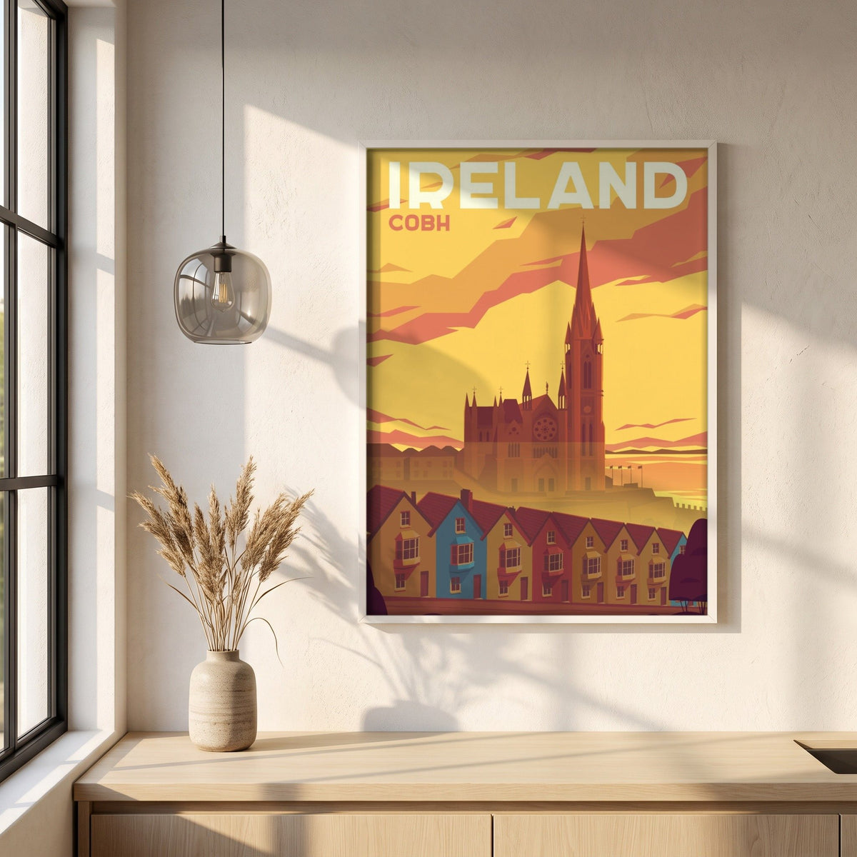 Cobh, Cork retro travel poster in a white frame on a plaster wall above an oak worktop in a bright Scandinavian kitchen