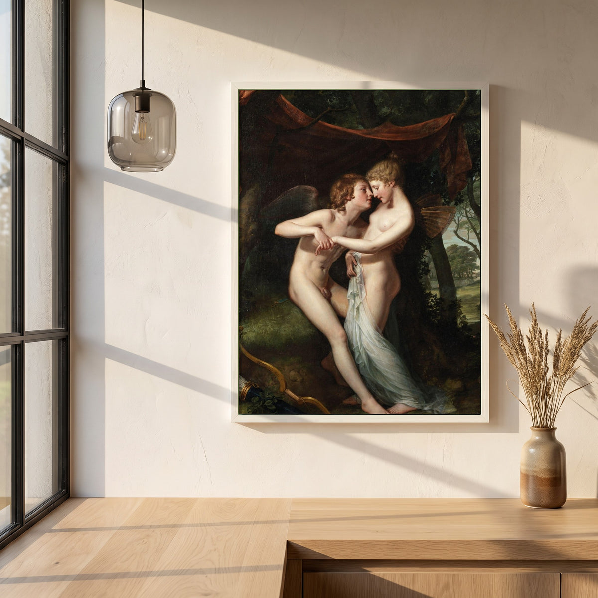 Cupid and Psyche framed print in a white frame on a plaster wall above an oak worktop in a bright Scandinavian kitchen
