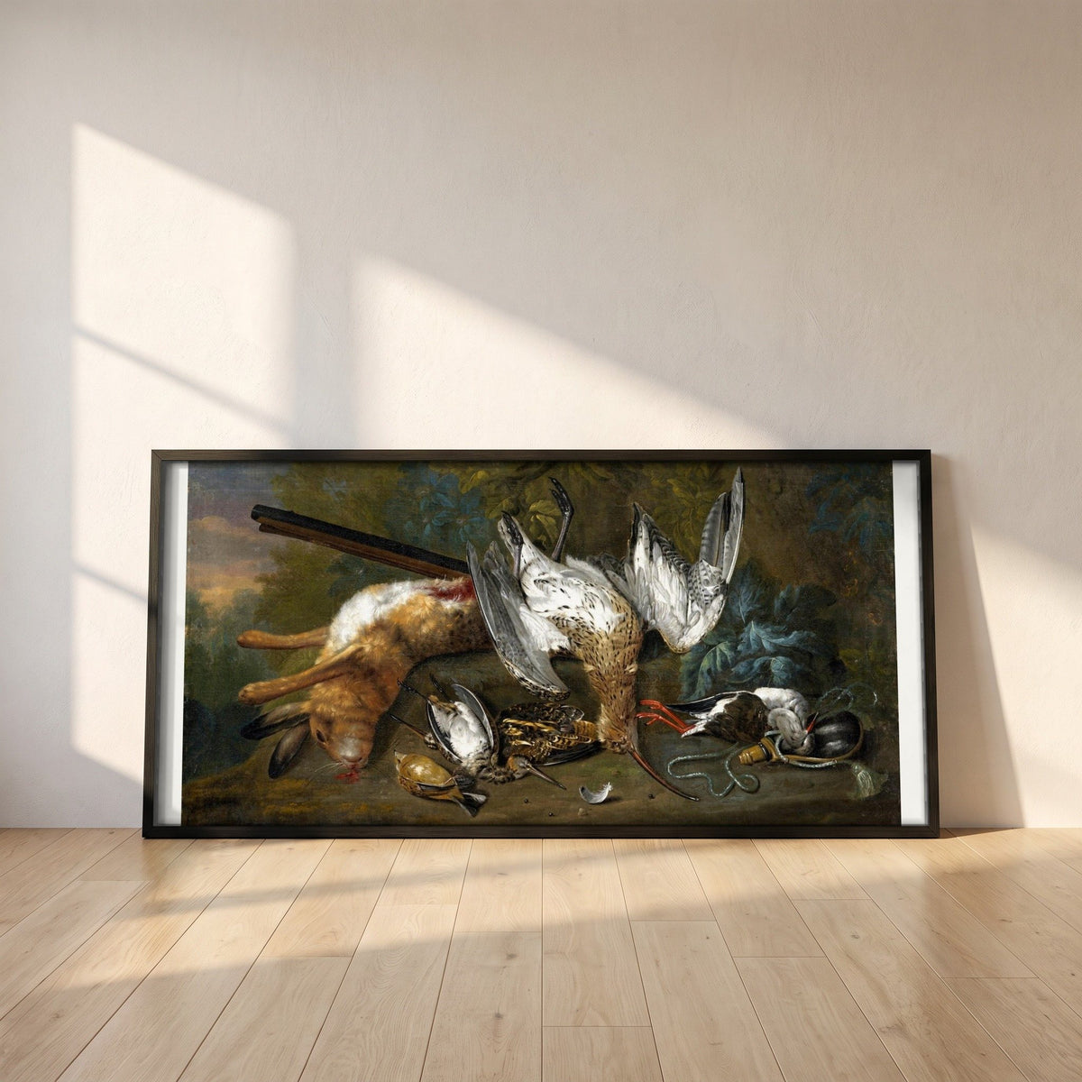 Dead Game, 1730 framed print in a black frame leaning against a white plaster wall on oak floorboards in morning light