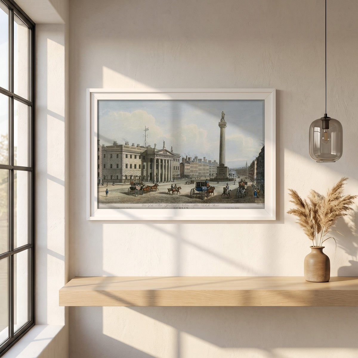 GPO & Nelson's Pillar, Dublin framed print in a white frame on a plaster wall above an oak worktop in a bright Scandinavian kitchen
