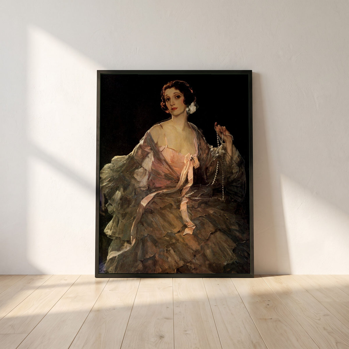 Hazel in Rose and Grey framed print in a black frame leaning against a white plaster wall on oak floorboards in morning light