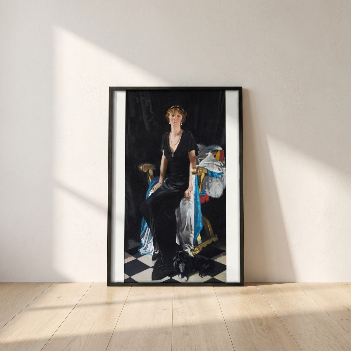 Idina Wallace framed print in a black frame leaning against a white plaster wall on oak floorboards in morning light
