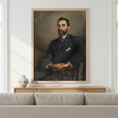 Roger Casement portrait by Sarah Purser in an oak frame above a low sideboard and grey sofa in a white room