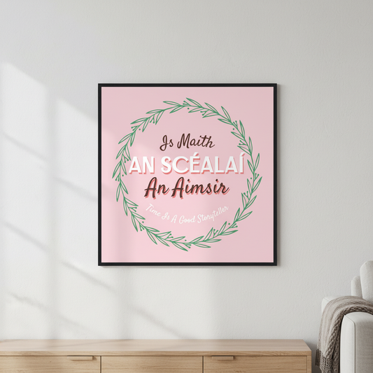 Is Maith an Scéalaí an Aimsir, Time Is A Good Storyteller print in a black frame above a wooden sideboard