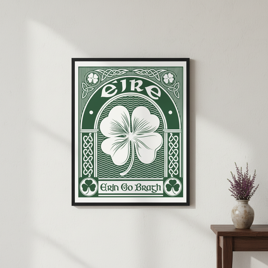 Erin Go Bragh shamrock print in a black frame on a white wall above a side table