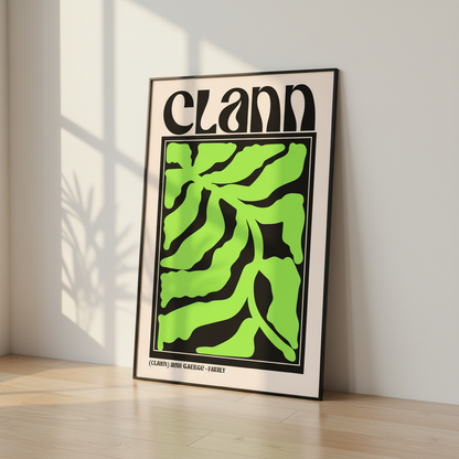 Clann Irish word for family print in a black frame leaning against a wall on a wooden floor