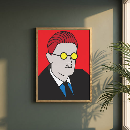 James Joyce Pop framed print in a natural oak frame on a dark green wall beside a window, dappled plant shadow