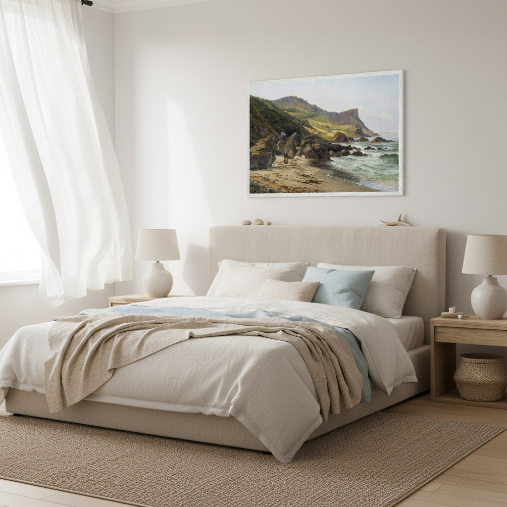 Murlough Bay and Fair Head print in a white frame above a bed in a light coastal bedroom