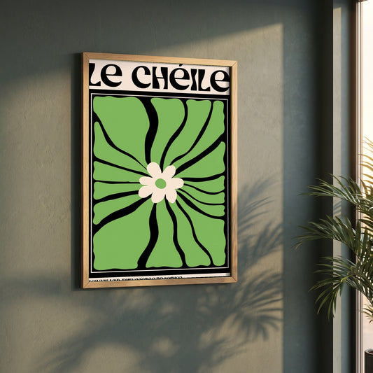 Le Chéile framed print in a natural oak frame on a dark green wall beside a window, dappled plant shadow