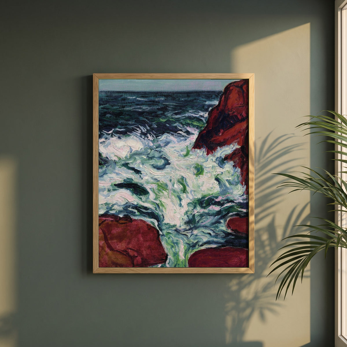 Marée Montante framed print in a natural oak frame on a dark green wall beside a window, dappled plant shadow