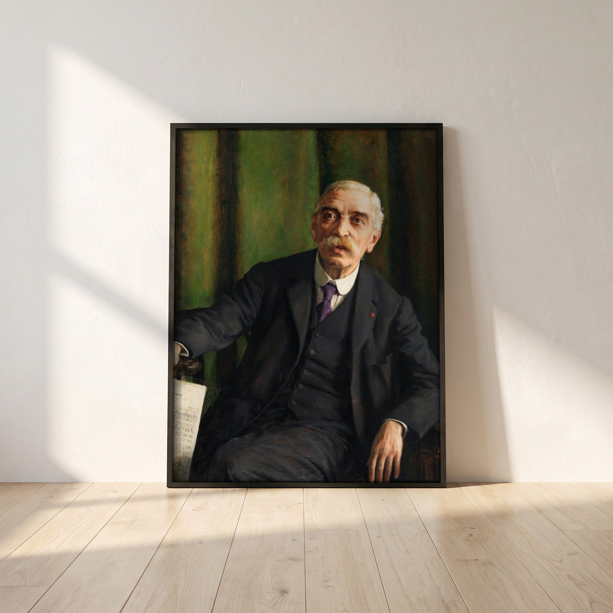 Michele Esposito framed print in a black frame leaning against a white plaster wall on oak floorboards in morning light