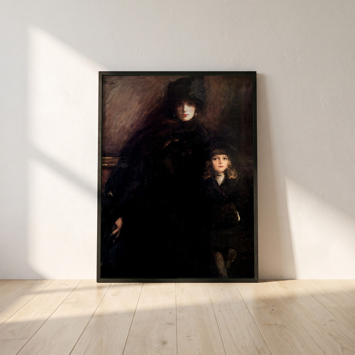 Mrs Lavery and Alice framed print in a black frame leaning against a white plaster wall on oak floorboards in morning light