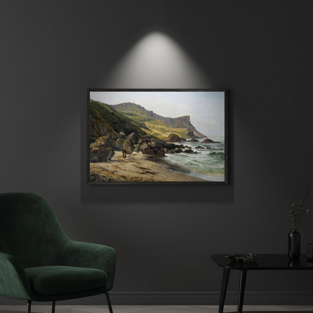 Murlough Bay print in a black frame under a spotlight on a charcoal wall with a green velvet chair